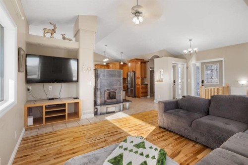 149 Sharp Hill Drive, Rural Rocky View County, AB - Indoor Photo Showing Living Room With Fireplace