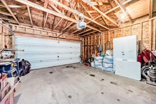 76 Tuscany Way Nw, Calgary, AB - Indoor Photo Showing Garage