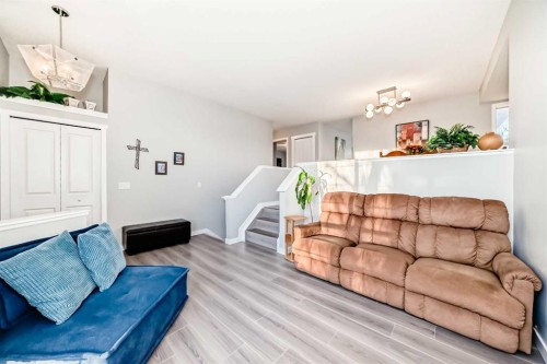 76 Tuscany Way Nw, Calgary, AB - Indoor Photo Showing Living Room