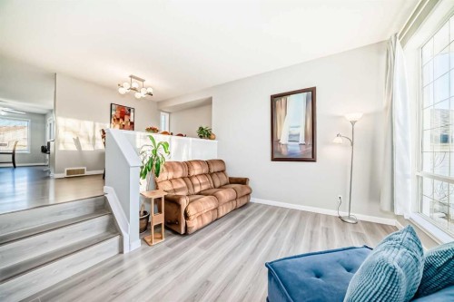 76 Tuscany Way Nw, Calgary, AB - Indoor Photo Showing Living Room