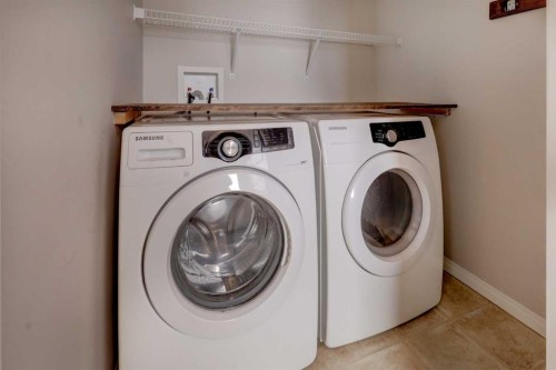 16 Fireside Way, Cochrane, AB - Indoor Photo Showing Laundry Room