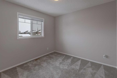 16 Fireside Way, Cochrane, AB - Indoor Photo Showing Other Room
