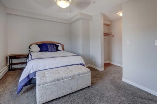 3301-403 Mackenzie Way Sw, Airdrie, AB - Indoor Photo Showing Bedroom