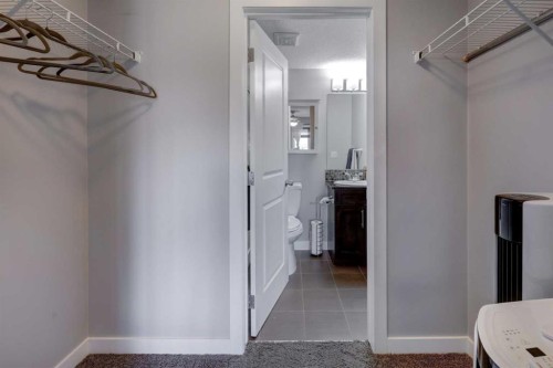 3301-403 Mackenzie Way Sw, Airdrie, AB - Indoor With Storage