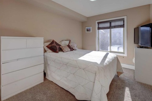 3301-403 Mackenzie Way Sw, Airdrie, AB - Indoor Photo Showing Bedroom
