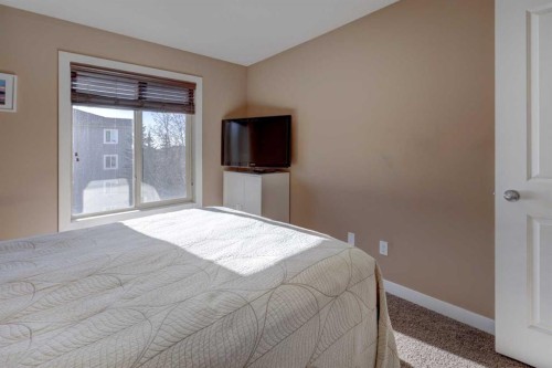 3301-403 Mackenzie Way Sw, Airdrie, AB - Indoor Photo Showing Bedroom