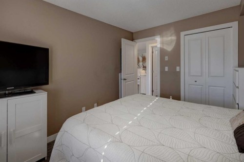 3301-403 Mackenzie Way Sw, Airdrie, AB - Indoor Photo Showing Bedroom