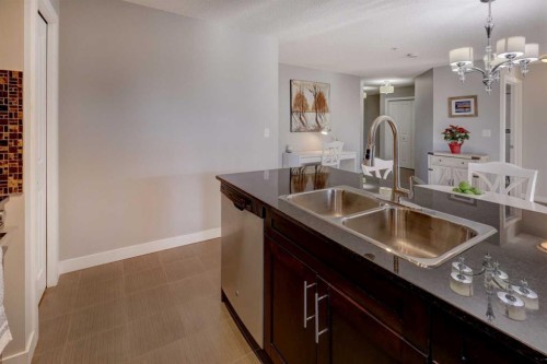 3301-403 Mackenzie Way Sw, Airdrie, AB - Indoor Photo Showing Kitchen With Double Sink