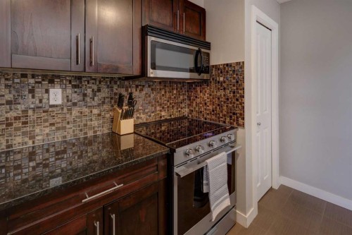 3301-403 Mackenzie Way Sw, Airdrie, AB - Indoor Photo Showing Kitchen