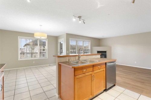129 Evansbrooke Way Nw, Calgary, AB - Indoor Photo Showing Kitchen With Double Sink