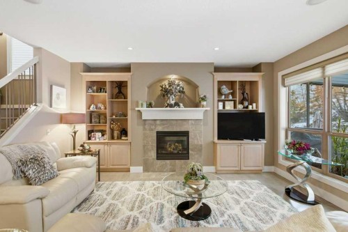 247 St Moritz Drive Sw, Calgary, AB - Indoor Photo Showing Living Room With Fireplace