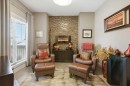 247 St Moritz Drive Sw, Calgary, AB  - Indoor Photo Showing Other Room With Fireplace 