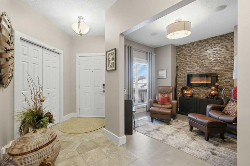 247 St Moritz Drive Sw, Calgary, AB - Indoor Photo Showing Other Room With Fireplace