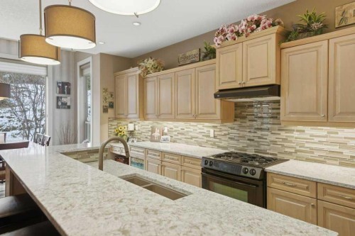 247 St Moritz Drive Sw, Calgary, AB - Indoor Photo Showing Kitchen With Double Sink With Upgraded Kitchen
