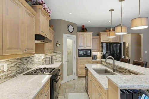 247 St Moritz Drive Sw, Calgary, AB - Indoor Photo Showing Kitchen With Double Sink With Upgraded Kitchen