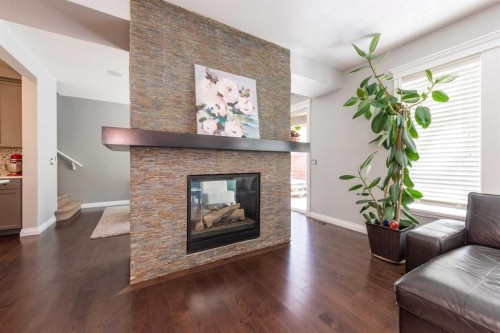 67 Auburn Sound Manor Se, Calgary, AB - Indoor Photo Showing Living Room With Fireplace