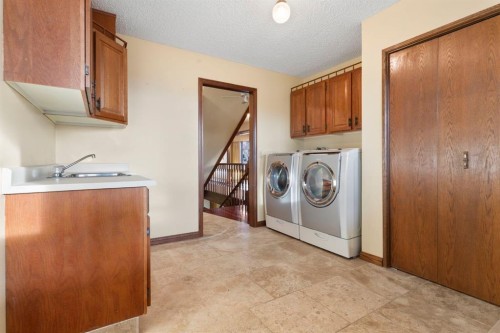 39 Coach Gate Way Sw, Calgary, AB - Indoor Photo Showing Laundry Room