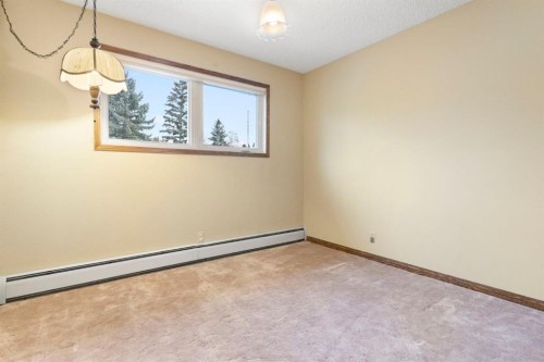 39 Coach Gate Way Sw, Calgary, AB - Indoor Photo Showing Other Room