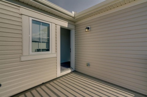 4 Southwinds Gate Sw, Airdrie, AB - Outdoor With Deck Patio Veranda With Exterior