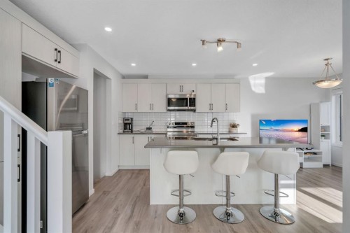 4 Southwinds Gate Sw, Airdrie, AB - Indoor Photo Showing Kitchen With Stainless Steel Kitchen With Upgraded Kitchen