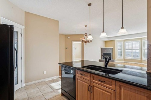 417-15 Everstone Drive Sw, Calgary, AB - Indoor Photo Showing Kitchen With Double Sink