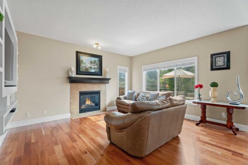 113 Aspen Stone Place Sw, Calgary, AB - Indoor Photo Showing Living Room With Fireplace