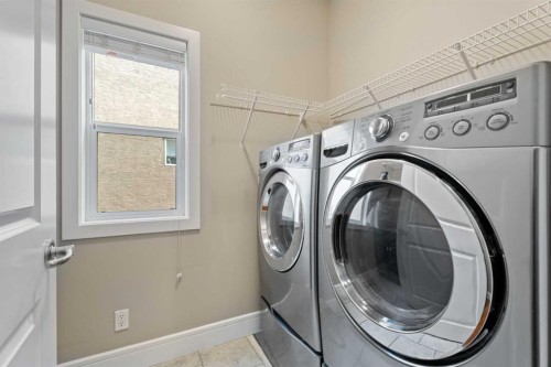 113 Aspen Stone Place Sw, Calgary, AB - Indoor Photo Showing Laundry Room