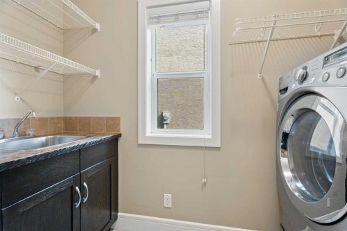 113 Aspen Stone Place Sw, Calgary, AB - Indoor Photo Showing Laundry Room