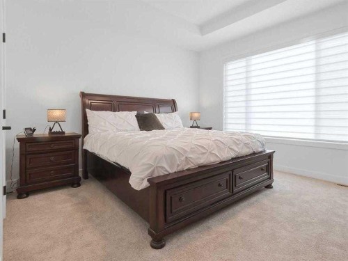 110 Sunstone Way, Balzac, AB - Indoor Photo Showing Bedroom