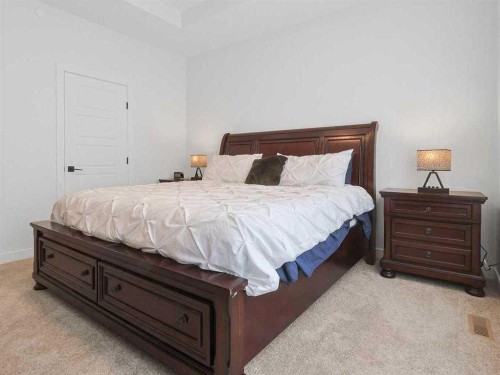 110 Sunstone Way, Balzac, AB - Indoor Photo Showing Bedroom