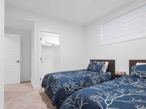 110 Sunstone Way, Balzac, AB - Indoor Photo Showing Bedroom