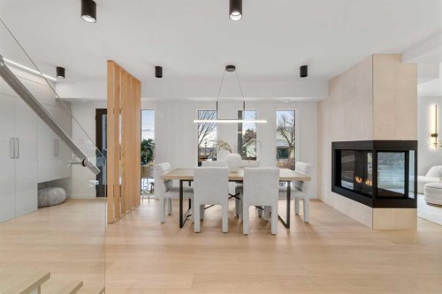 3531 Spruce Drive Sw, Calgary, AB - Indoor Photo Showing Dining Room With Fireplace