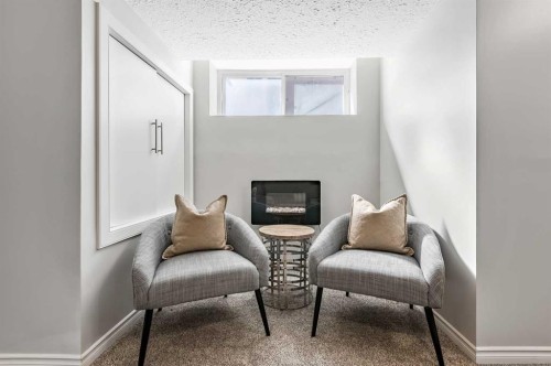 6 Autumn Green Se, Calgary, AB - Indoor Photo Showing Other Room With Fireplace