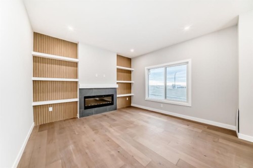 508 Heritage Boulevard, Cochrane, AB - Indoor Photo Showing Other Room With Fireplace