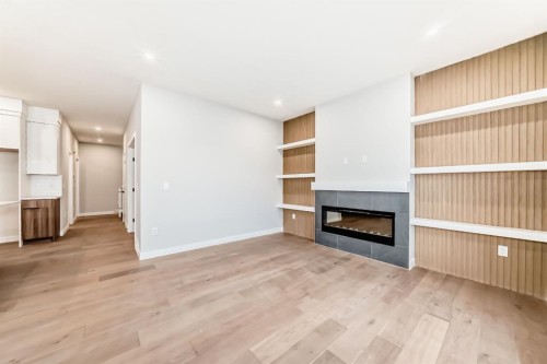 508 Heritage Boulevard, Cochrane, AB - Indoor Photo Showing Living Room With Fireplace