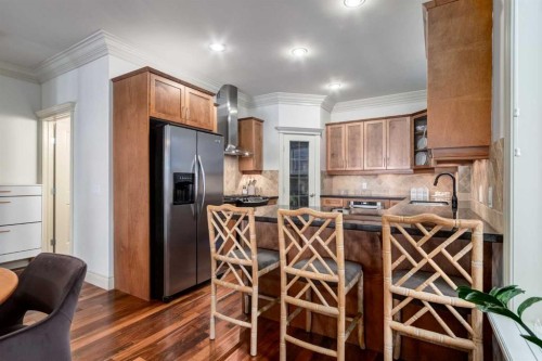 1-2413 2 Avenue Nw, Calgary, AB - Indoor Photo Showing Kitchen With Stainless Steel Kitchen
