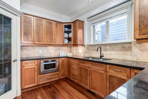 1-2413 2 Avenue Nw, Calgary, AB - Indoor Photo Showing Kitchen With Double Sink