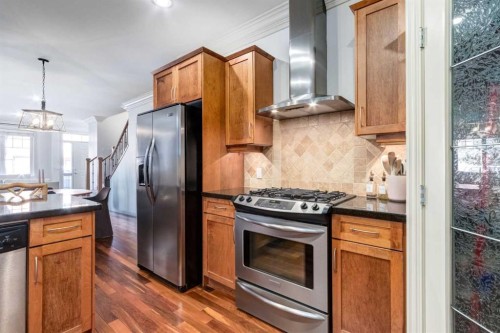 1-2413 2 Avenue Nw, Calgary, AB - Indoor Photo Showing Kitchen With Stainless Steel Kitchen
