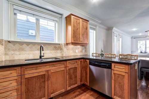 1-2413 2 Avenue Nw, Calgary, AB - Indoor Photo Showing Kitchen With Double Sink