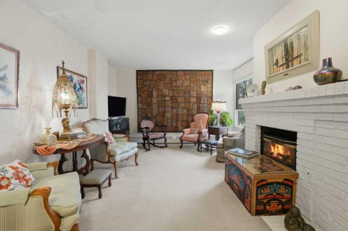 225-2425 90 Avenue Sw, Calgary, AB - Indoor Photo Showing Living Room With Fireplace