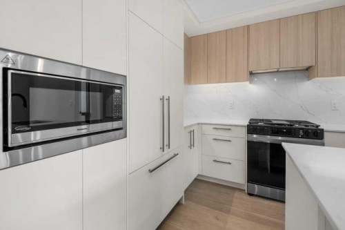 306-8375 Broadcast Avenue, Calgary, AB - Indoor Photo Showing Kitchen With Upgraded Kitchen
