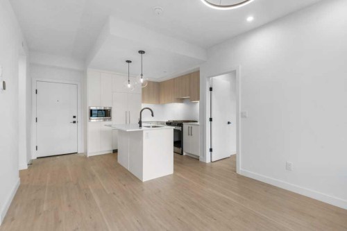 306-8375 Broadcast Avenue, Calgary, AB - Indoor Photo Showing Kitchen With Upgraded Kitchen