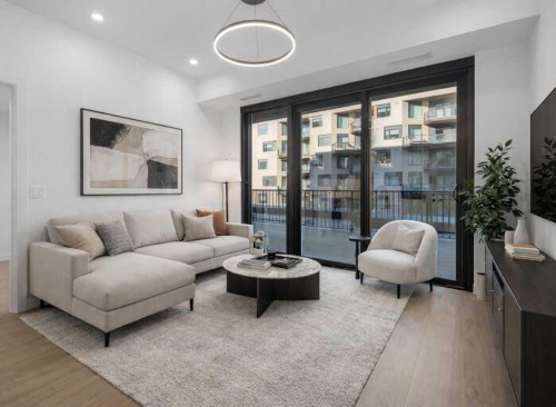 306-8375 Broadcast Avenue, Calgary, AB - Indoor Photo Showing Living Room
