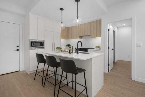 306-8375 Broadcast Avenue, Calgary, AB - Indoor Photo Showing Kitchen With Upgraded Kitchen