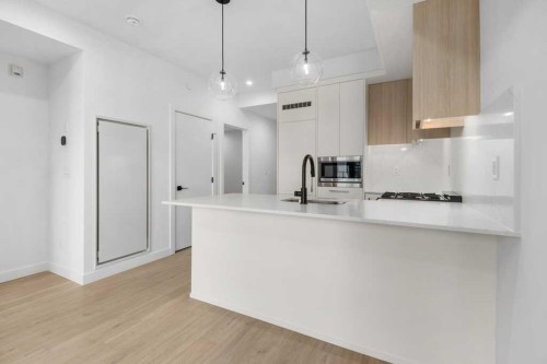 409-8375 Broadcast Avenue, Calgary, AB - Indoor Photo Showing Kitchen With Upgraded Kitchen