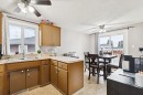 157 Penbrooke Close Se, Calgary, AB  - Indoor Photo Showing Kitchen With Double Sink 