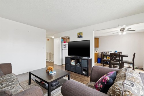 157 Penbrooke Close Se, Calgary, AB - Indoor Photo Showing Living Room