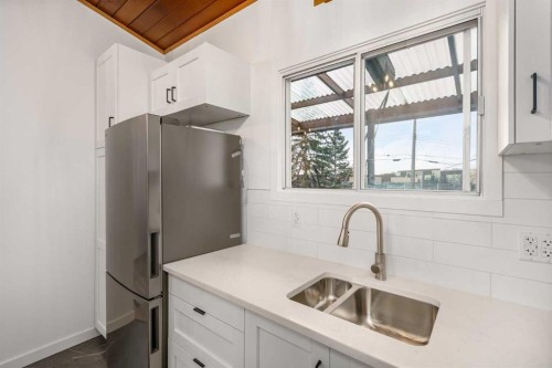15 A Arlington Bay Se, Calgary, AB - Indoor Photo Showing Kitchen With Double Sink
