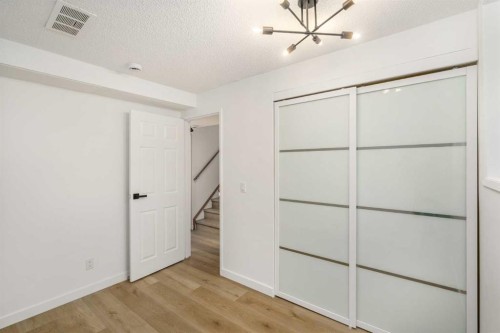 15 A Arlington Bay Se, Calgary, AB - Indoor Photo Showing Other Room
