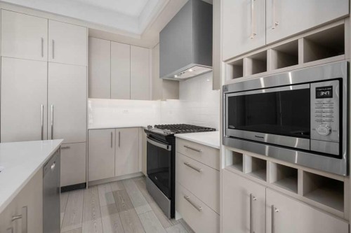 612-8230 Broadcast Avenue, Calgary, AB - Indoor Photo Showing Kitchen With Upgraded Kitchen